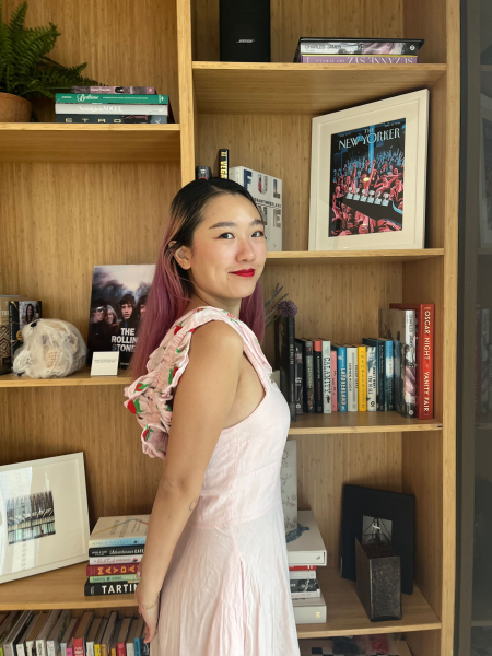 A side profile photo of Allure commerce editor Sarah Han wearing Cakes Sticky Cakes Circles underneath a light pink dress